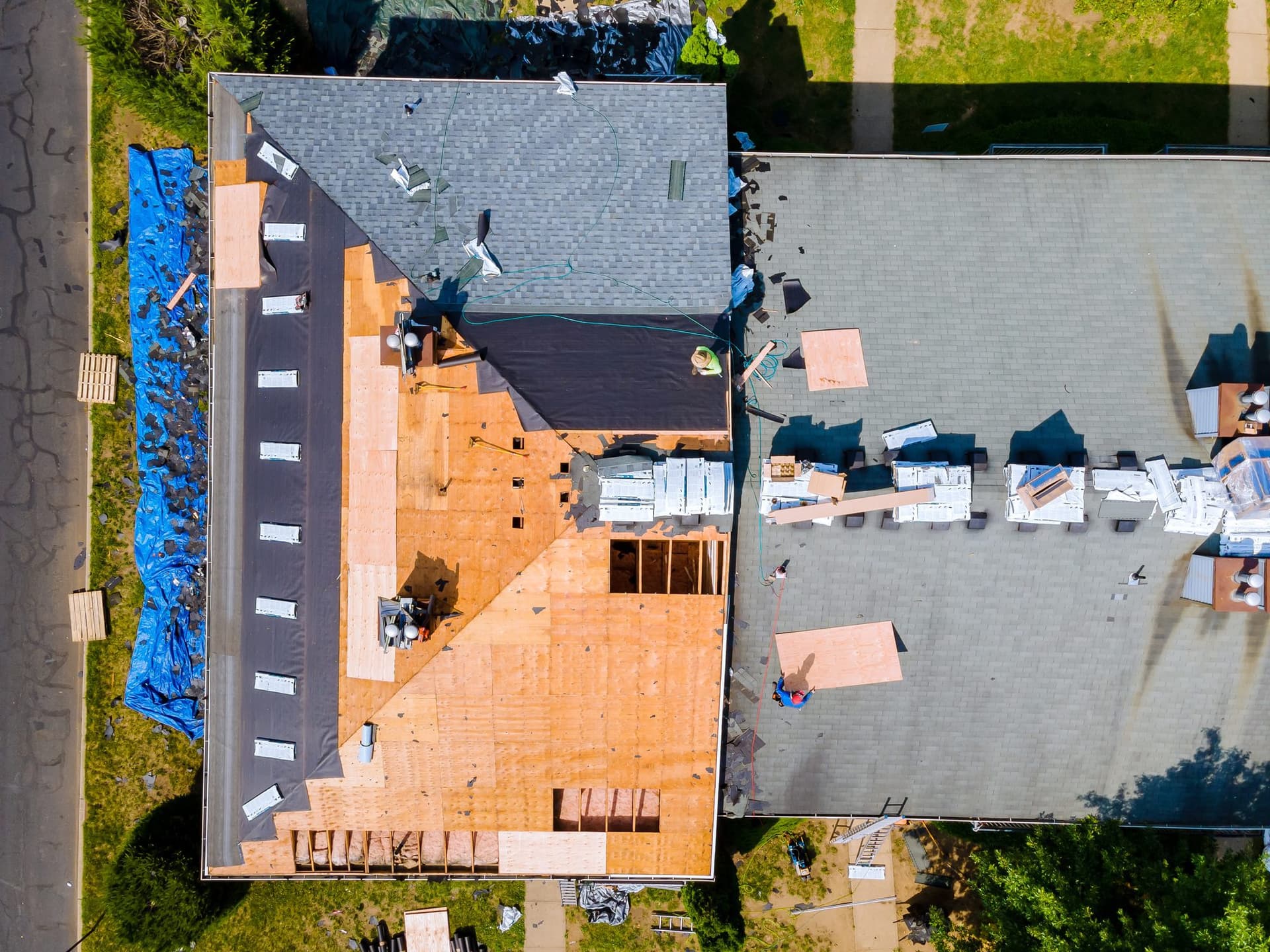 Skyline Construction team installing new asphalt shingles on residential home in Northern Virginia
